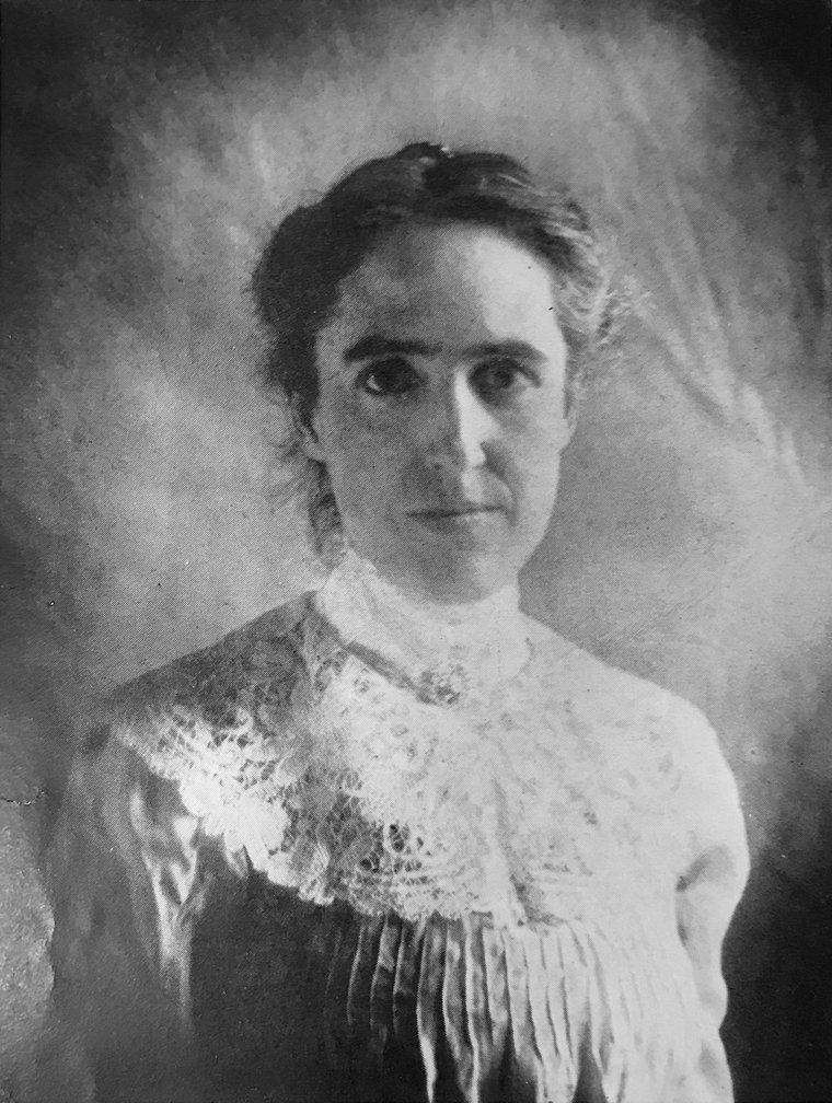 Portrait photograph of Henrietta Swan Leavitt at her desk